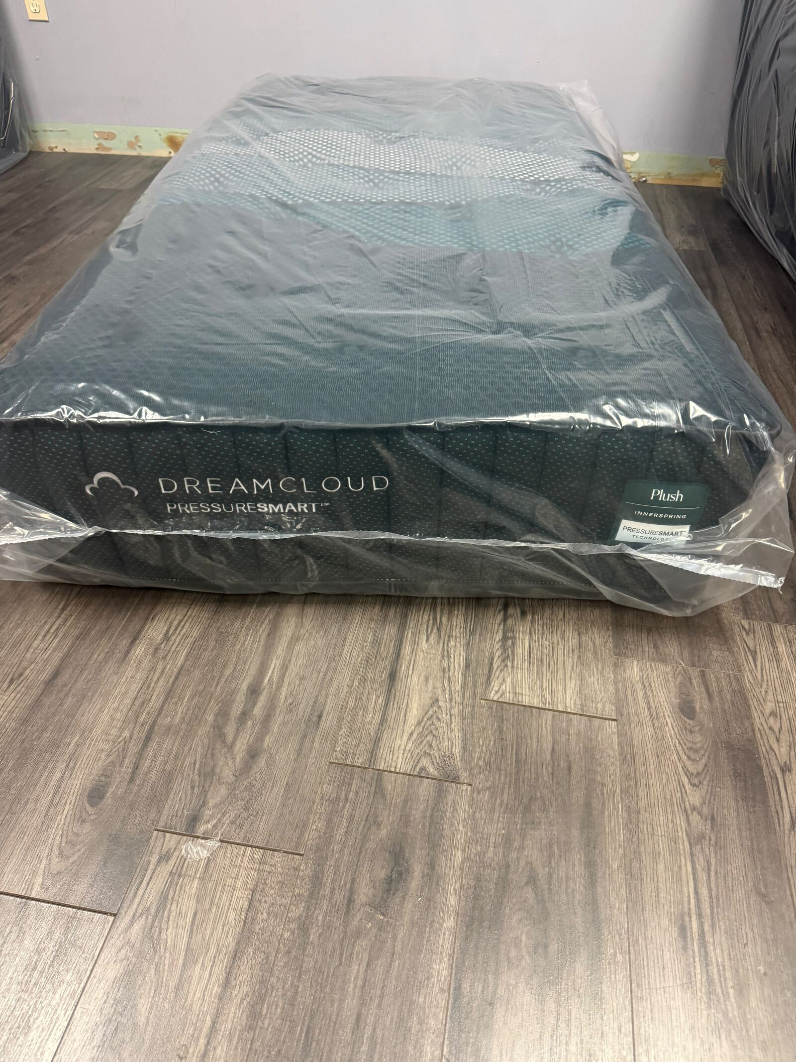 DreamCloud PressureSmart plush mattress in protective wrapping