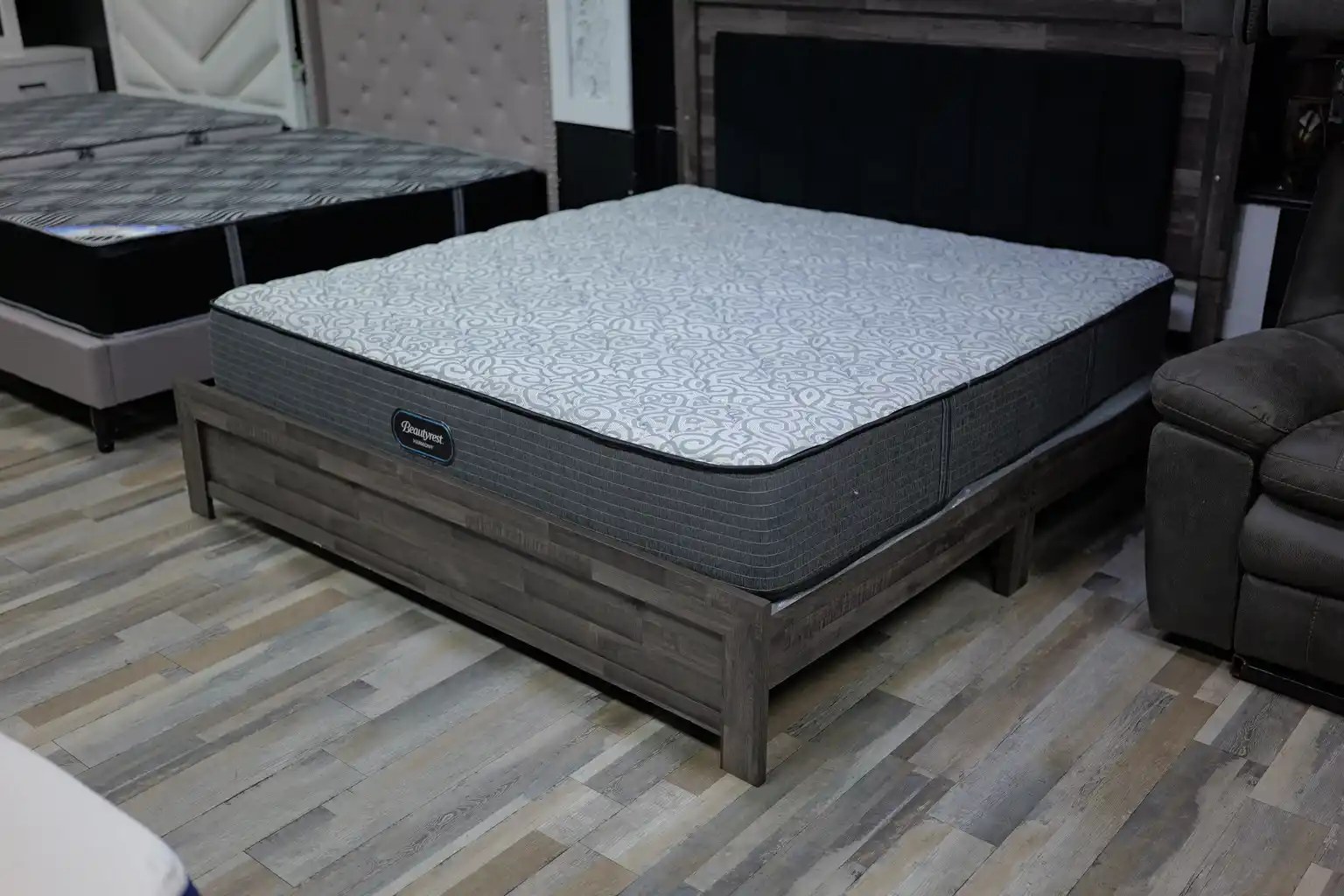 Spring and foam mattress on a dark wood bed frame